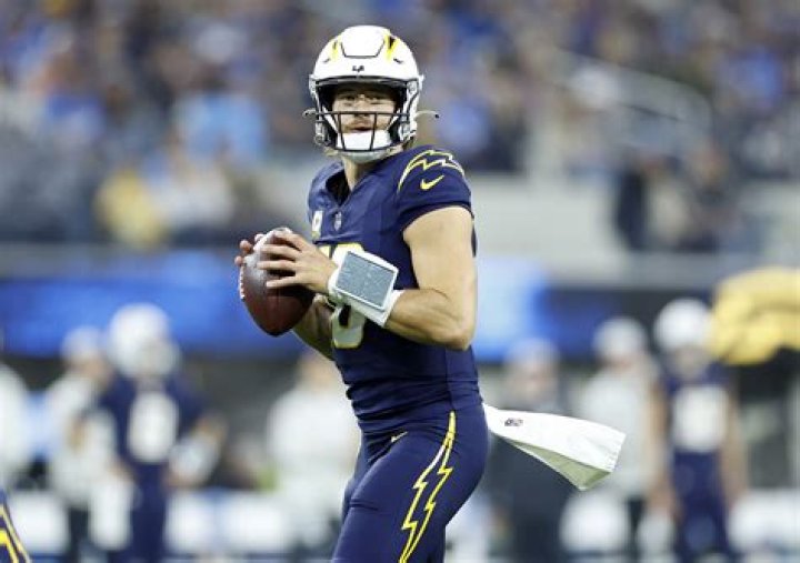 Justin Herbert of the Los Angeles Chargers seals the game with an interception against the Dallas Cowboys. - SarkariResult